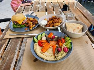 For me: Hummus, vegetables, baked potato. For her: beyond, baked potato. at BuenaVida Vegan in Tenerife