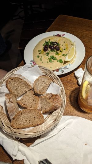Small hummus plate with bread at Cafe Gagarin in Vienna