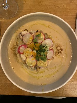 Hazelnut mashed potatoes with white asparagus, orange whole grain mustard vinaigrette and rooibos and tamari cream and radish   at Le Potager de Charlotte in Paris