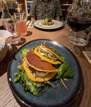Chickpea pancakes and tofu in the background at Le Potager de Charlotte in Paris