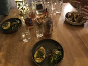 Two people got the avocado "eggs" and one got the chickpea pancakes. Both are very popular and are kept in the menu throughout seasons. I preferred the avocado.  at Le Potager de Charlotte in Paris