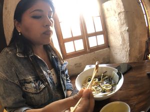 Contemplating life in the reflection of the ramen  at El Buda Profano in Arequipa
