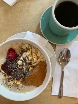 porridge with peanut butter and berry compote, and a black filter at Espresso Library in Cambridge
