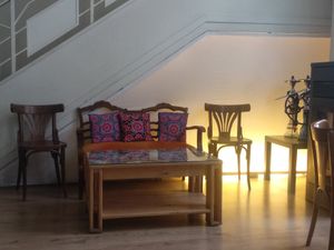 Rincones con sofás y estufa at Tuma in Segovia