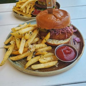 Chicken sandwich with garlic parmesan fries 🔥 at Little Pine in Los Angeles