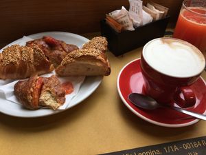 Vegan breakfast: 2 flavors croissant (seeds and orange), orange juice, coffee (cappuccino with soy milk) at La Licata in Rome