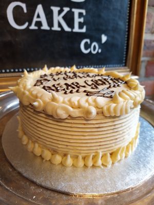 Vegan sponge with vegan buttercream, available in a range of flavours, personalised with a message piped in chocolate at The Kind Cake Co in Hebden Bridge