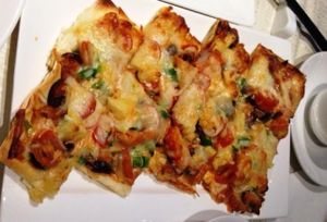 Pizza with mock seafood and Mozzarella cheese at Veg 6 in Hong Kong Island