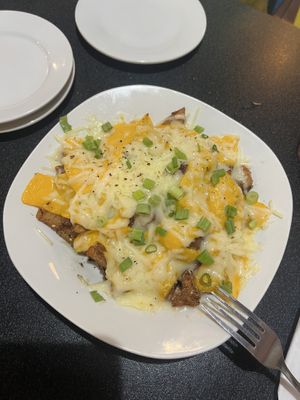 Loaded taters with vegan cheese. Sadly they were out of vegan bacon!   at Dancing Avocado in Daytona Beach