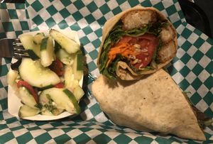 “Chicken” tender wrap with side cucumber salad at Dancing Avocado in Daytona Beach