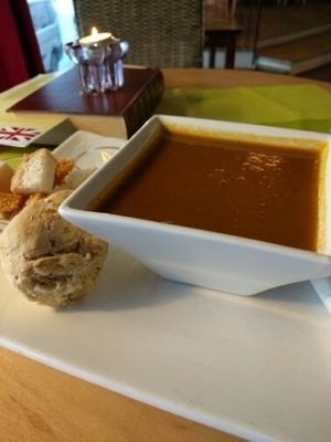 sweet and spicy paprika soup (vegan) with bread and croutons at Kafe Kafka in Bodo
