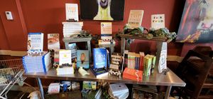 WFPB library with books for sale - took me a decade to get most of these books!!! at GreenFare Organic Cafe in Herndon
