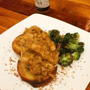 jackfruit encocado, pepita quinoa areas, charred broccoli, and vegan coconut bacon! at Luna Rotisserie & Empanadas in Durham