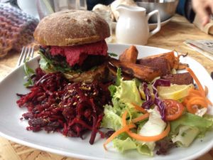 Burger plus sweet potato chips and salad. at Urban Zen in Swansea