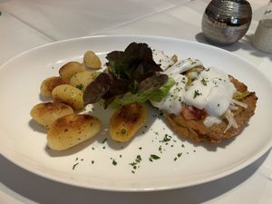 Vegan schnitzel with vegan cheese, peppers, and tomatoes  at Zur Pfaffschenke in Kaiserslautern