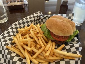 Behind meat burger with pepper jack cheese and friessss ❤️🌱 at Clovermint Cafe and Market in Dania Beach