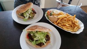 Seitan burgers and large fries with peanut sauce and mayonnaise at Vegs in Halle