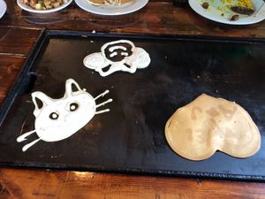 Vegan pancakes cooking on the griddle table at Backwater in Melbourne