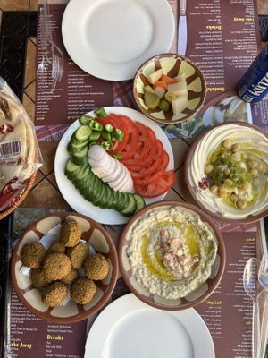 Falafel, salad, hommus and moutabal.   at Abo Shariha in Doha