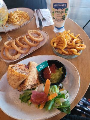 Sweet Potato and Squash Chilli Burrito (VG) , Onion Rings, and Curly Fries. at Las Iguanas in Ellesmere Port