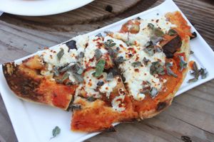 Eggplant & Tomato Flatbread has cheese :( at Shams El Balad Cafe in Amman