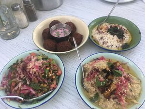 Beetroot falafel, hummus, farmers salad and mutabal at Shams El Balad Cafe in Amman