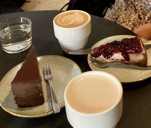 Chocolate cake, New York cheesecake, latte and chai latte.  at Kaf in Copenhagen