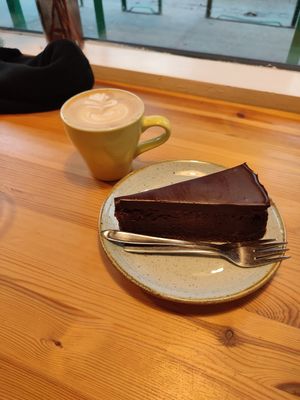 Triple chocolate cheesecake and oat flat white at Kaf in Copenhagen