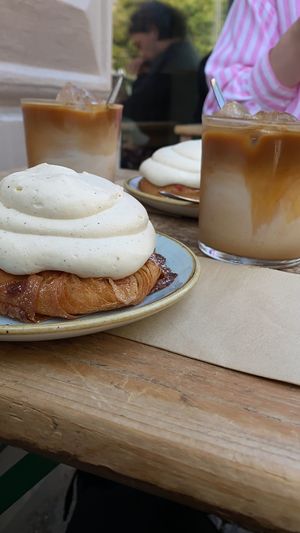 “Kaf buns” with strawberries and iced oat latte  at Kaf in Copenhagen