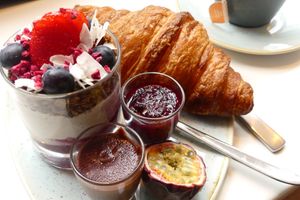 Croissant with homemade jam and chocolate spread.
Homemade Cashew yogurt with homemade granola, topped with some fruit. So delicious! at Kaf in Copenhagen