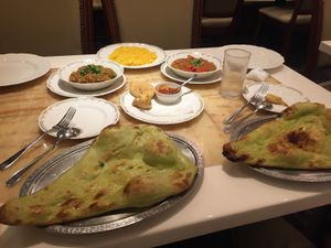 veggie pakoras (half eaten... hehe), chana masala, baingan bharta, turmeric rice, and vegan naan!  at Milan Nataraj in Tokyo