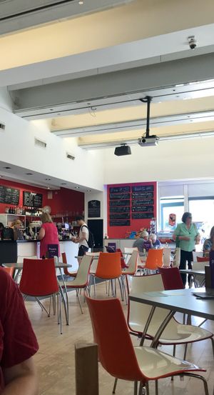 Interior and specials board with 2 vegan dishes at Phoenix Cafe Bar in Leicester