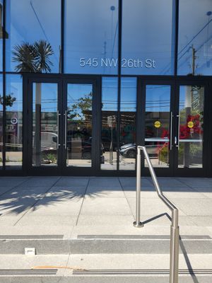 If you walk in this way, you have to walk through these doors and the staff at the front desk will direct you to how to get to the restaurant at Love Life Cafe in Miami