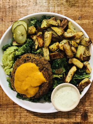 Veggie burger, kale, golden potatoes  at Love Life Cafe in Miami
