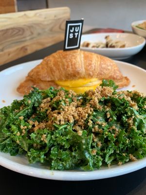 Breakfast croissant with kale salad.  at Love Life Cafe in Miami