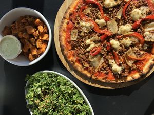 Pizza diabola, with sweet potatoe “chips” and kale salad on the side.  at Love Life Cafe in Miami
