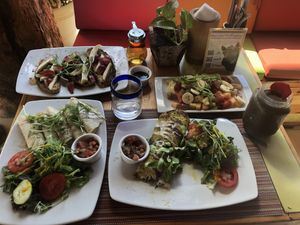 Clockwise top: French toast, fruit, spinach omelette, & quesadilla w salads at Clorofila in Playa Del Carmen