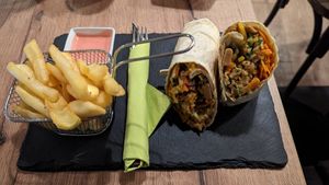 Curry 'chicken' wrap. Fries with pink mayo. at Veggiezz - Am Salzgriess in Vienna