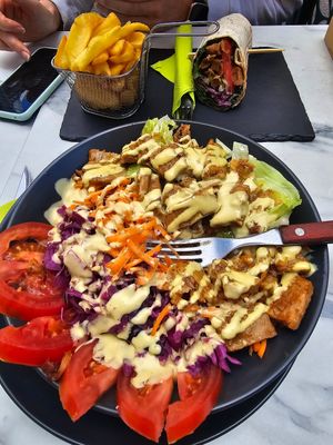 Chicken poke bowl and seitan gyro wrap at Veggiezz - Am Salzgriess in Vienna