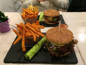 Seitan burgers with sweet potato fries. at Veggiezz - Am Salzgriess in Vienna