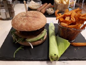 A glutenfree burger made if pea-protein and sweet potatoes chips at Veggiezz - Am Salzgriess in Vienna