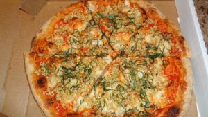 Vegan marinara pizza takeout with cashew mozzarella and pine nut parmesan. Excellent!  at Crumb & Spigot in Chagrin Falls