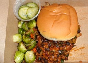 Vegan sloppy joe takeout with roasted brussels sprouts side at Crumb & Spigot in Chagrin Falls