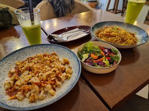 left side the ravioli with garlic and a salad.   spaghetti bolognese on the right side at KafeNAsanat in Istanbul