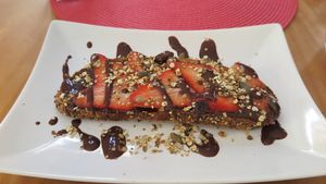 Tartine - Strawberry, chocolate and homemade glutenfree granola at Dona Flor Cafe in Cascais