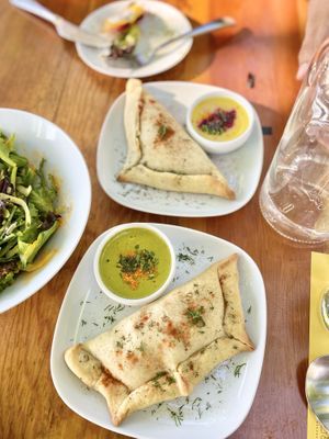 Sweet potato and seitan empanadas with ají Amarillo and verde salsas.  at Epif in Portland