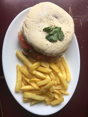 Burger with fries at Kome Vegan in Valparaiso