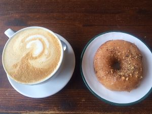 oatmilk Latte and salted caramel hazelnut Donut  at Brammibal's Donuts - Maybachufer in Berlin