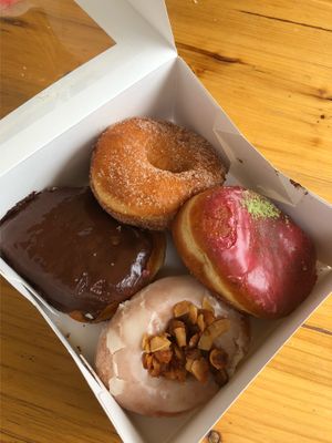 Boston cream, cinnamon sugar, raspberry matcha & maple smoked coconut at Brammibal's Donuts - Maybachufer in Berlin