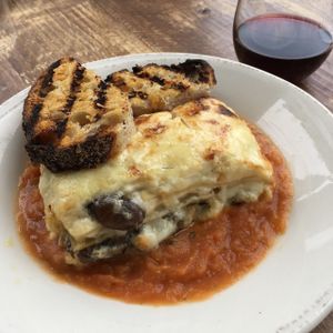 5-Cheese Mushroom Lasagne with a house-made roasted tomato sauce and grilled garlic bread. Crimini and porcini mushrooms with a tarragon infused béchamel sauce. at Rosemary and Vine in Rye